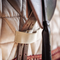 Détails du passage de sangle tapis de selle